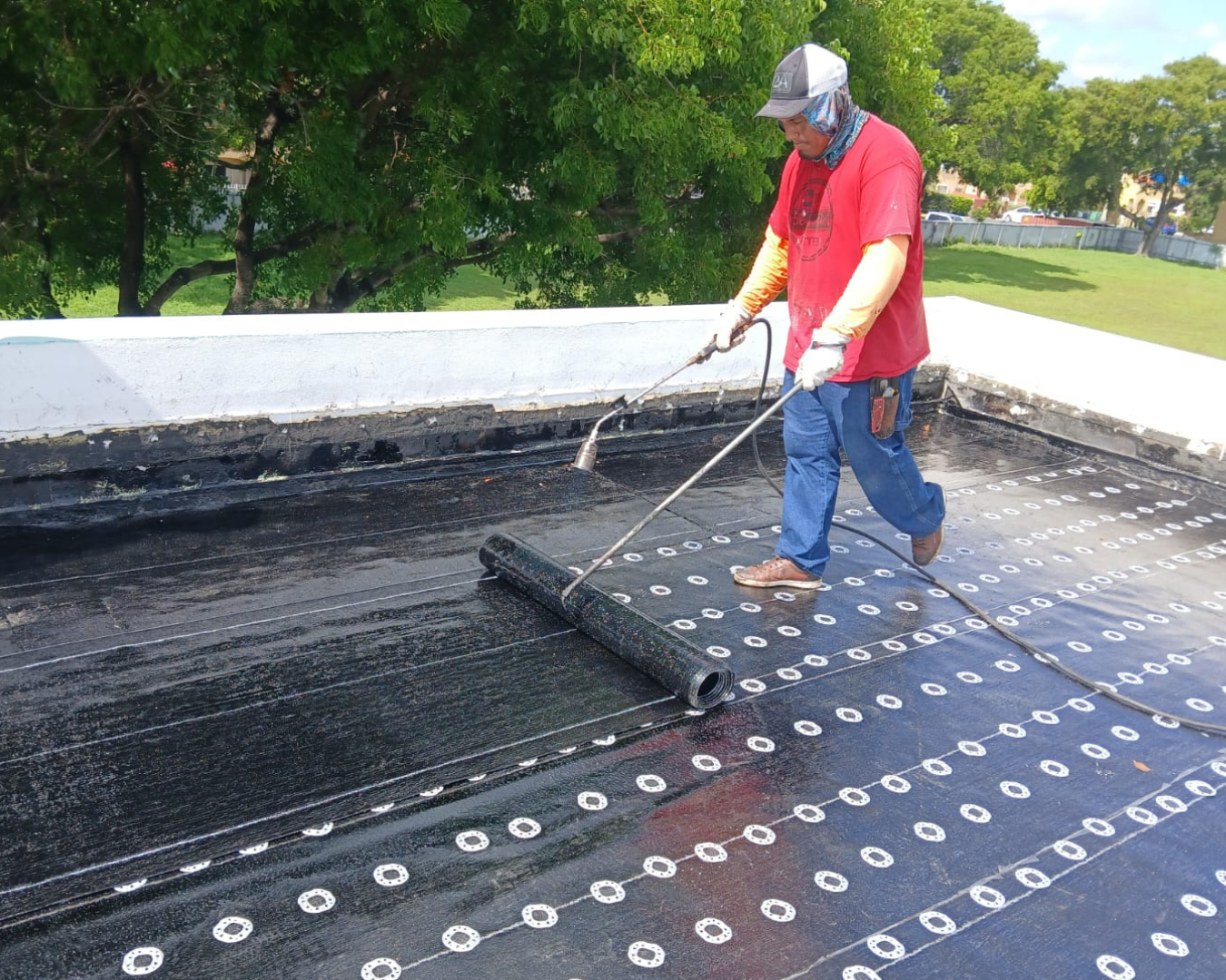 Local roofing contractor inspecting a residential roof in Florida