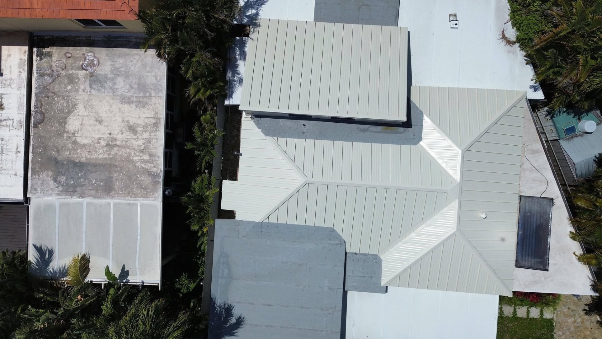 High-quality roof installation Florida showing roofing contractor installing shingles on Florida home