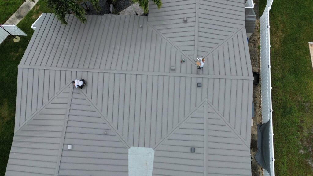Roofing Contractors Near Me installing a roofing system with proper workmanship and quality standards