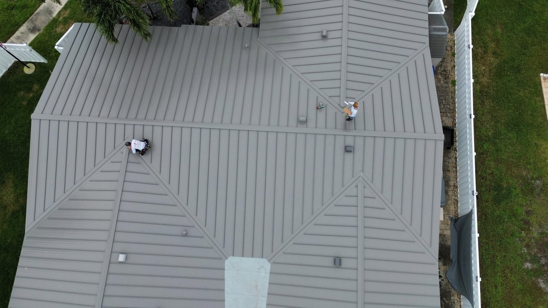 Roofing Contractors Near Me installing a roofing system with proper workmanship and quality standards