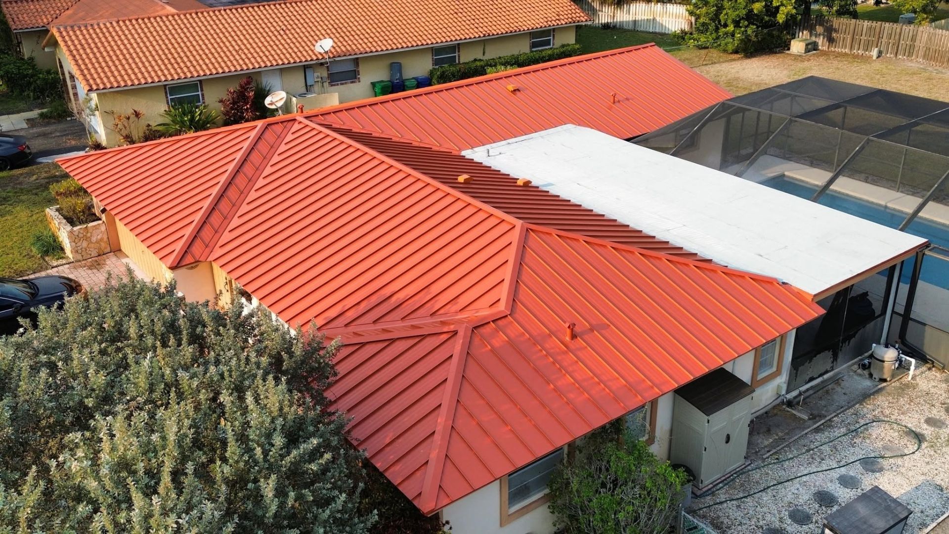 Roofing system installation showing decking, underlayment, and flashing beneath roofing materials